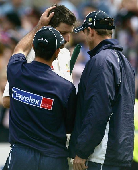 A distraught Kasprowicz being consoled after he was the last wicket to fall for Australia in Edgbaston test, 2005