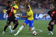Brazil's Richarlison tries to breach the Peruvian defence
