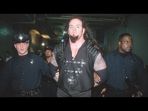 The Undertaker being arrested after trying to sacrifice The Big Bossman
