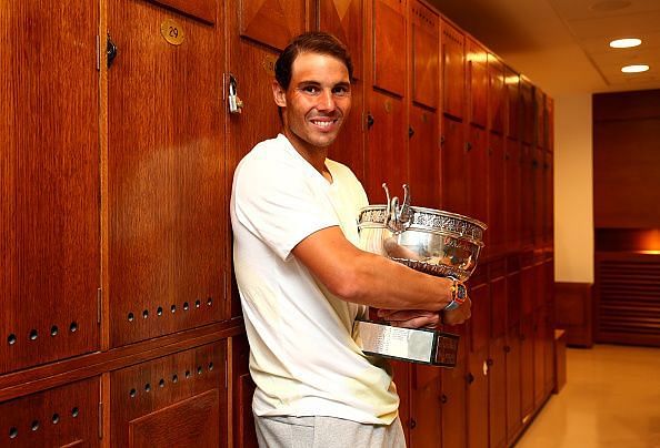 Nadal poses with his 12th French Open title in 2019