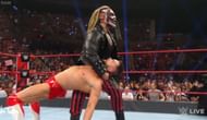 The Fiend prepares to apply his finishing maneuver to Finn Balor.