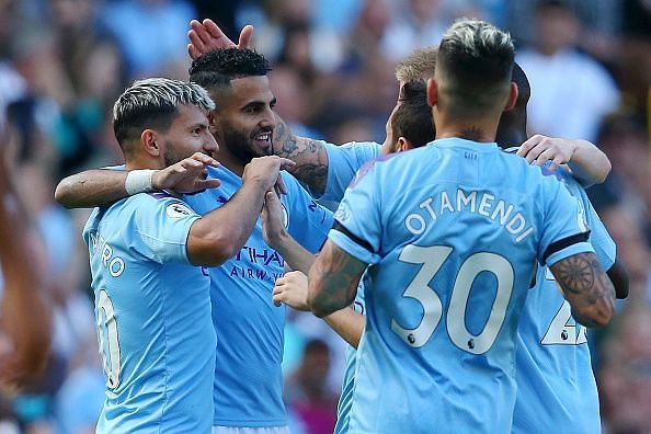 Mahrez celebrates his strike with teammates during a memorable home victory