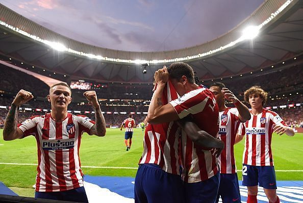 Atletico Madrid celebrated a last minute winner against Eibar to go top of the table