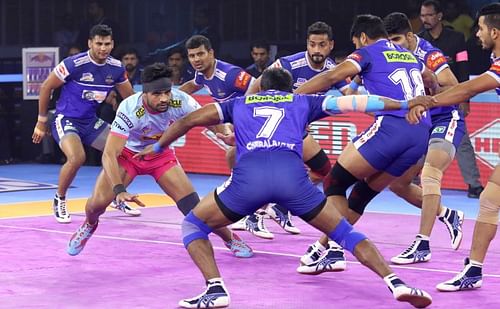 Haryana Steelers players tackle a raider