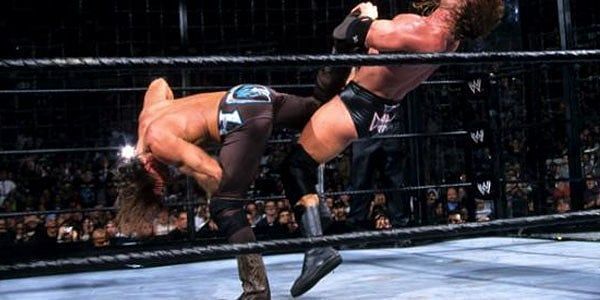 Shawn Michaels hits the mother of all Sweet Chin Music on Triple H during the first ever Elimination Chamber match.