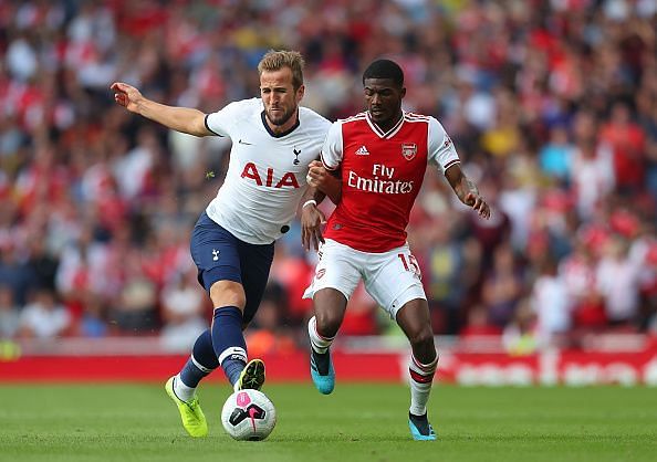 Ainsley Maitland Niles jostling with Harry Kane