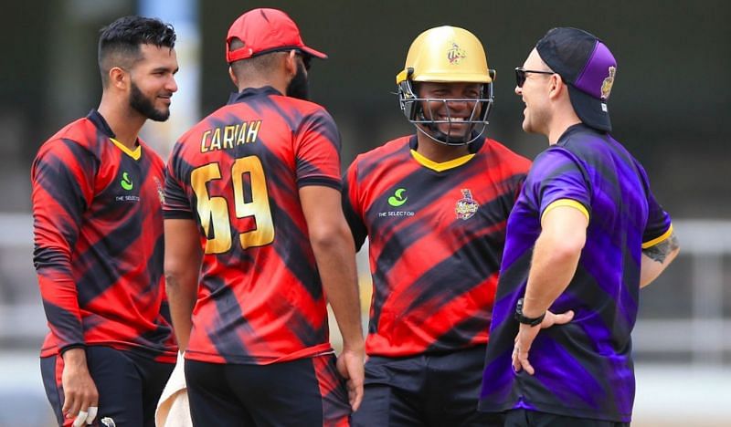 Brendon Mccullum, Head Coach, Trinbago Knight Riders in discussion with Brian Lara and other players.