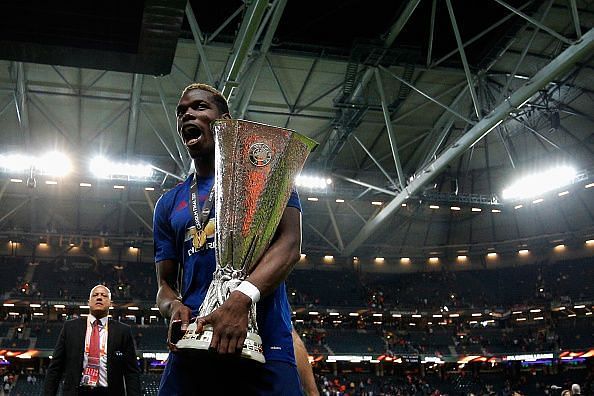 Manchester United&#039;s Paul Pogba with the Europa League trophy after beating Ajax