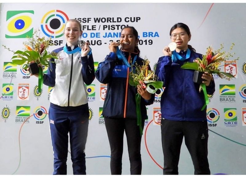 Elavenil Valarivan (Center) poses with her goal medal