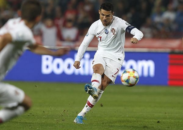 Cristiano Ronaldo scores from the spot against Lithuania in Vilnius