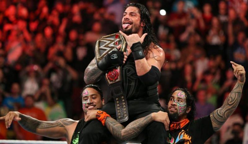 The Usos are seen celebrating one of Reigns&#039; 