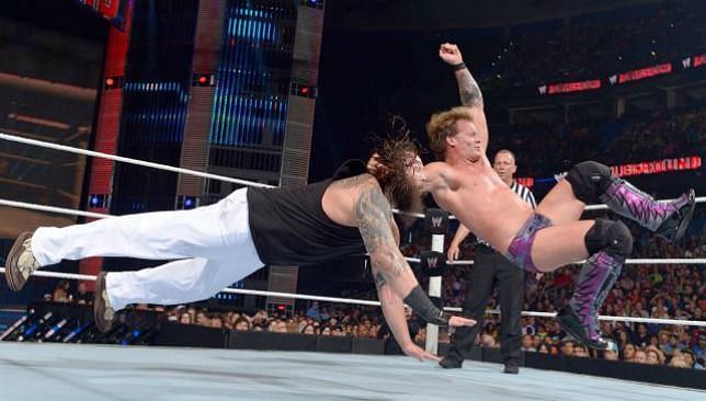 Chris Jericho hits a running bulldog on Bray Wyatt.