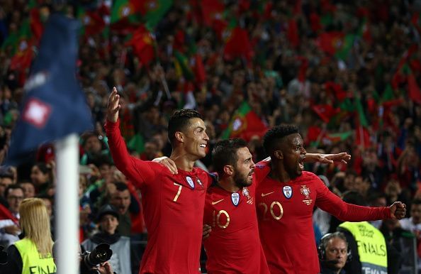 Bernardo Silva (middle) celebrates a goal with his teammates