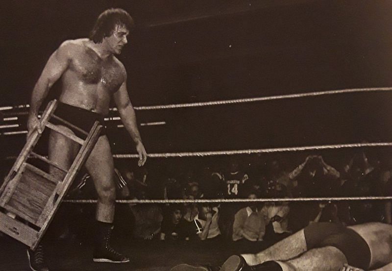 Larry Zybysko stands over his former mentor Bruno Sammartino in 1980.