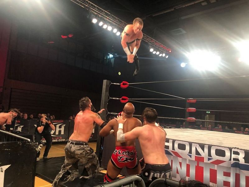 Kyle Fletcher taking to the skies after a series of suicide dives from everyone else at Ring of Honor