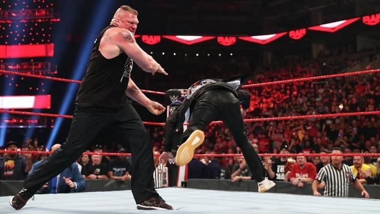 Brock Lesnar tossing Rey Mysterio