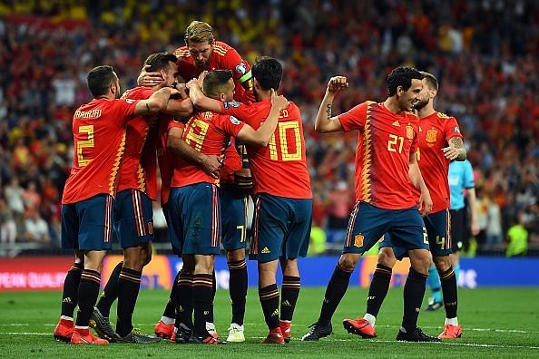 Spanish players celebrate during the previous clash between these two sides