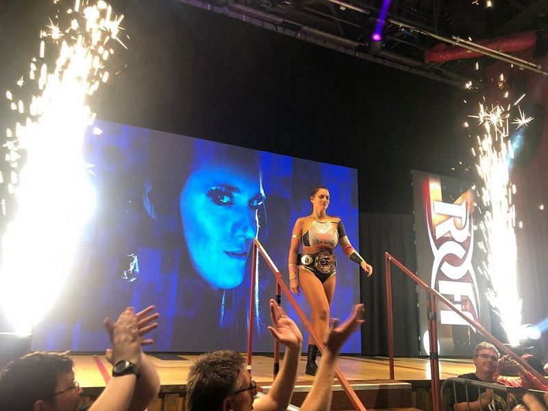 Woman of Honor Champion Kelly Klein making her entrance with pyro!