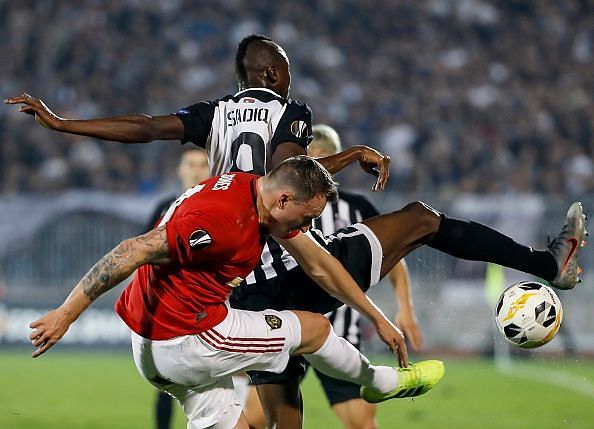 Partizan Belgrade v Manchester United - Sadiq Umar battles with the United rearguard