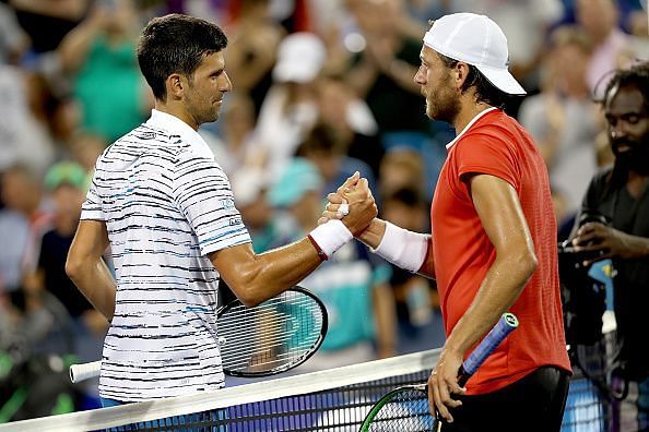 Novak Djokovic (L) and Lucas Pouille
