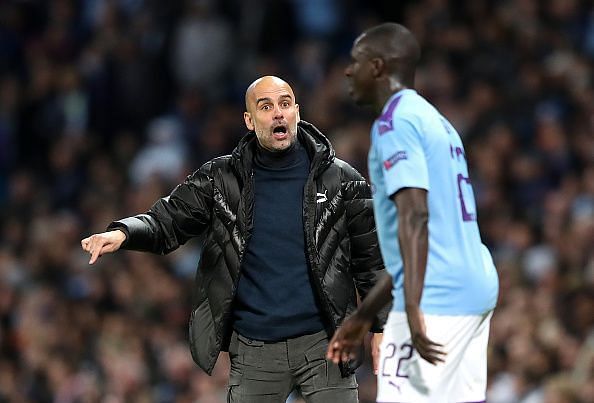 Manchester City&#039;s manager Pep Guardiola remonstrating with Benjamin Mendy