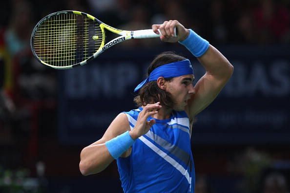 Nadal in action during 2007 Paris Masters.