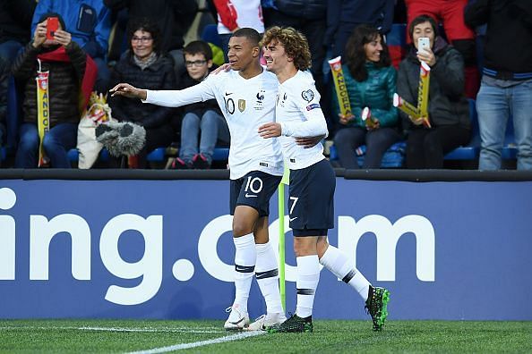 French players, Kylian Mbappe and Antoine Griezmann celebrate a goal