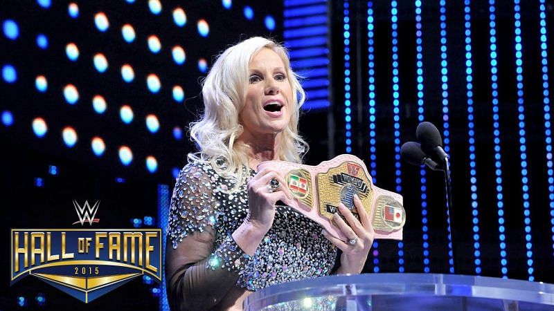 Alundra Blayze holding up the Women&#039;s Championship at the 2015 WWE Hall of Fame ceremony