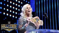 Alundra Blayze holding up the Women's Championship at the 2015 WWE Hall of Fame ceremony