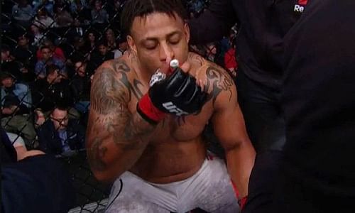 Greg Hardy using an inhaler