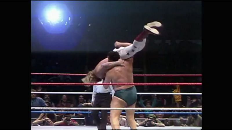 Andre hefts fellow big man Big John Studd in a body slam challenge match.