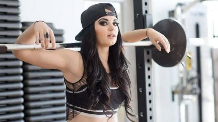 Paige posing for the camera at a gym