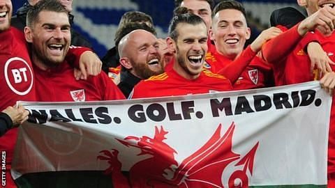 Gareth Bale holding the flag