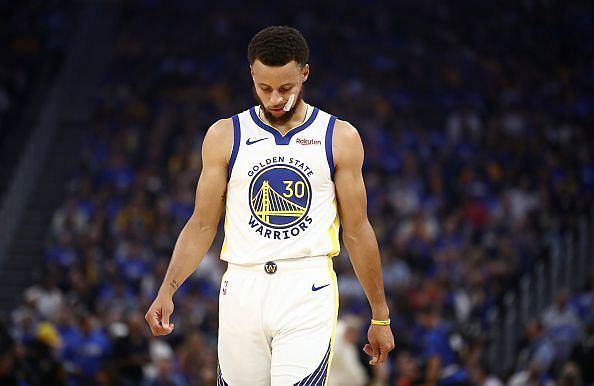 Stephen Curry suffered a broken hand (left) against the Phoenix Suns