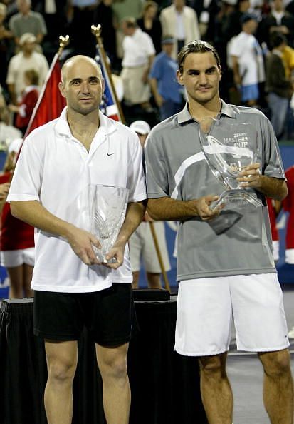 Andre Agassi (L) and Roger Federer
