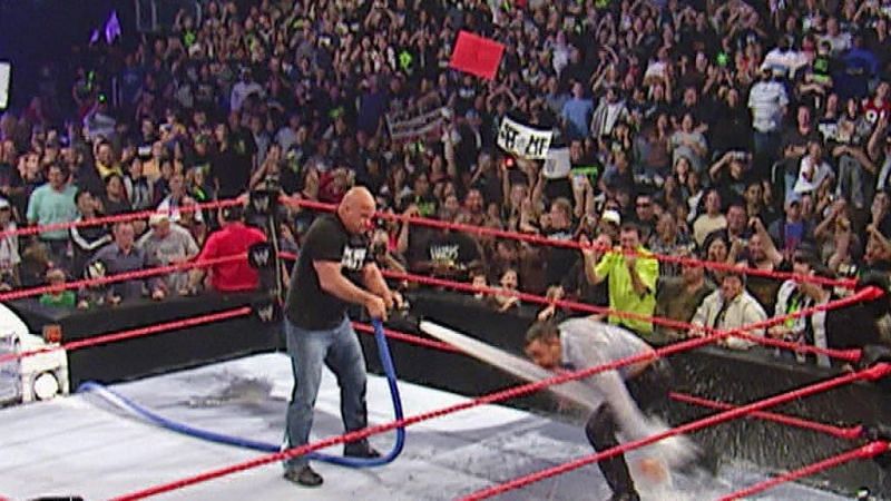 Stone Cold Steve Austin hoses down Vince McMahon on Raw in 1999.