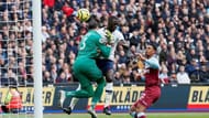 West Ham United's goalkeeper Roberto clashing with Tottenham Hotspur's Davinson Sanchez