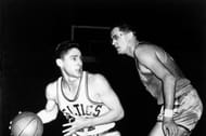 George Mikan of the Minneapolis Lakers guards Bill Sharman.