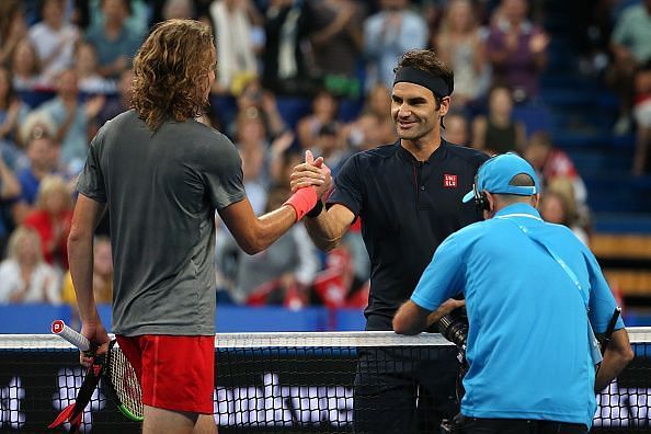 Stefanos Tsitsipas (L) and Roger Federer