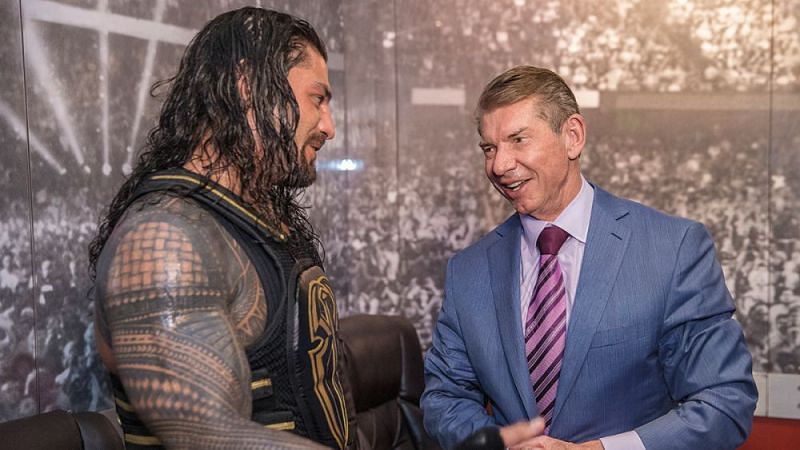 Roman Reigns and Vince McMahon.