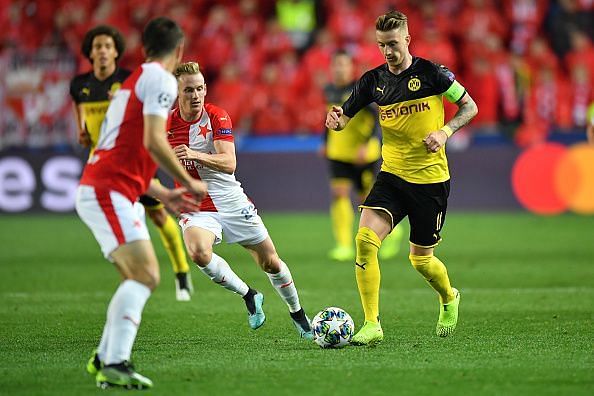 Reus, pictured here against Slavia Prague, has led by example with Dortmund this term