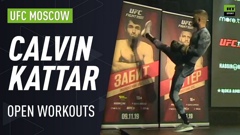 Kattar pretends to kick a backdrop display with Magomedsharipov&#039;s face on it