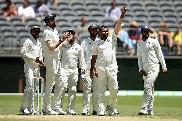 Mohammed Shami celebrates a wicket with teammates