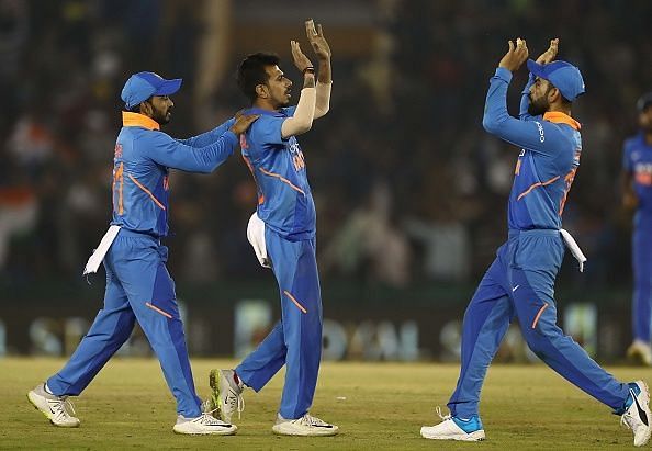 Yuzvendra Chahal celebrates a wicket with teammates