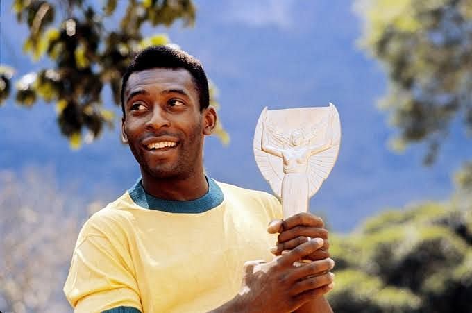 Pele posing with the Jules Rimet trophy in 1970