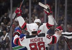 Devils strike fast, hold off Canucks 2-1