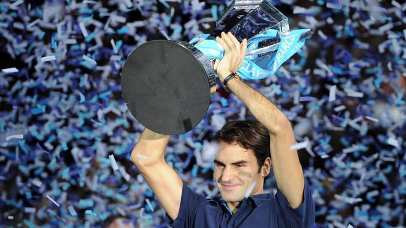 Roger Federer hoists aloft his record-sixth ATP Finals title in 2011