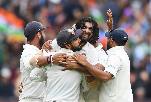 Ishant Sharma celebrates with teammates.