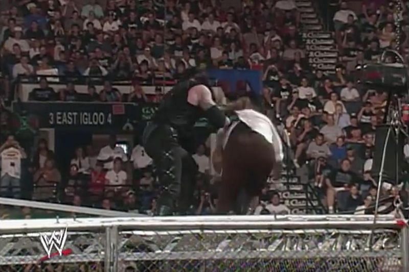 Taker throws Foley off the top of the Cell in an all-time epic moment