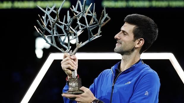 Novak Djokovic hoists aloft his record-extending 5th Paris Masters title